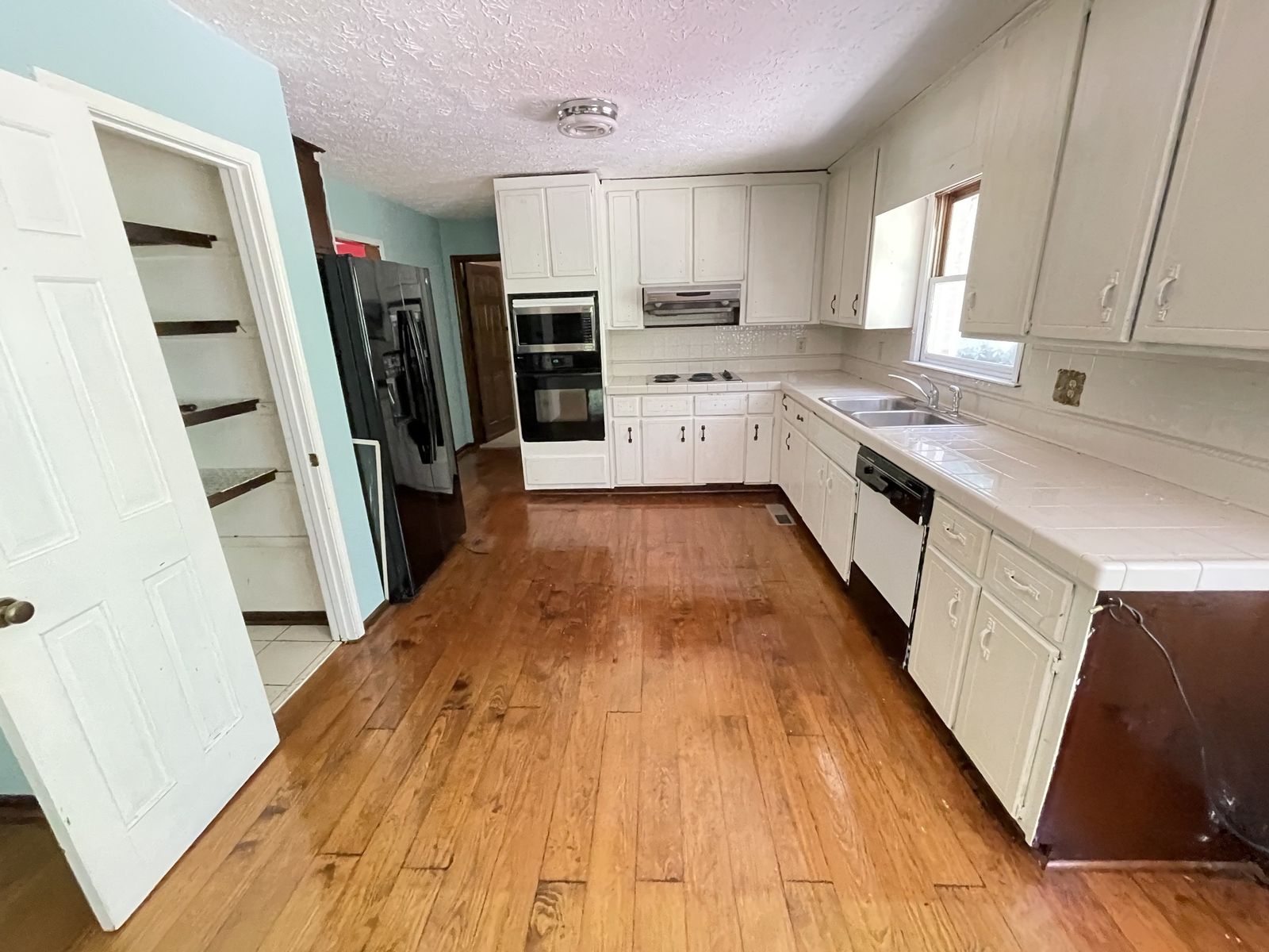 Before: dated kitchen, from one of Wesley’s own projects